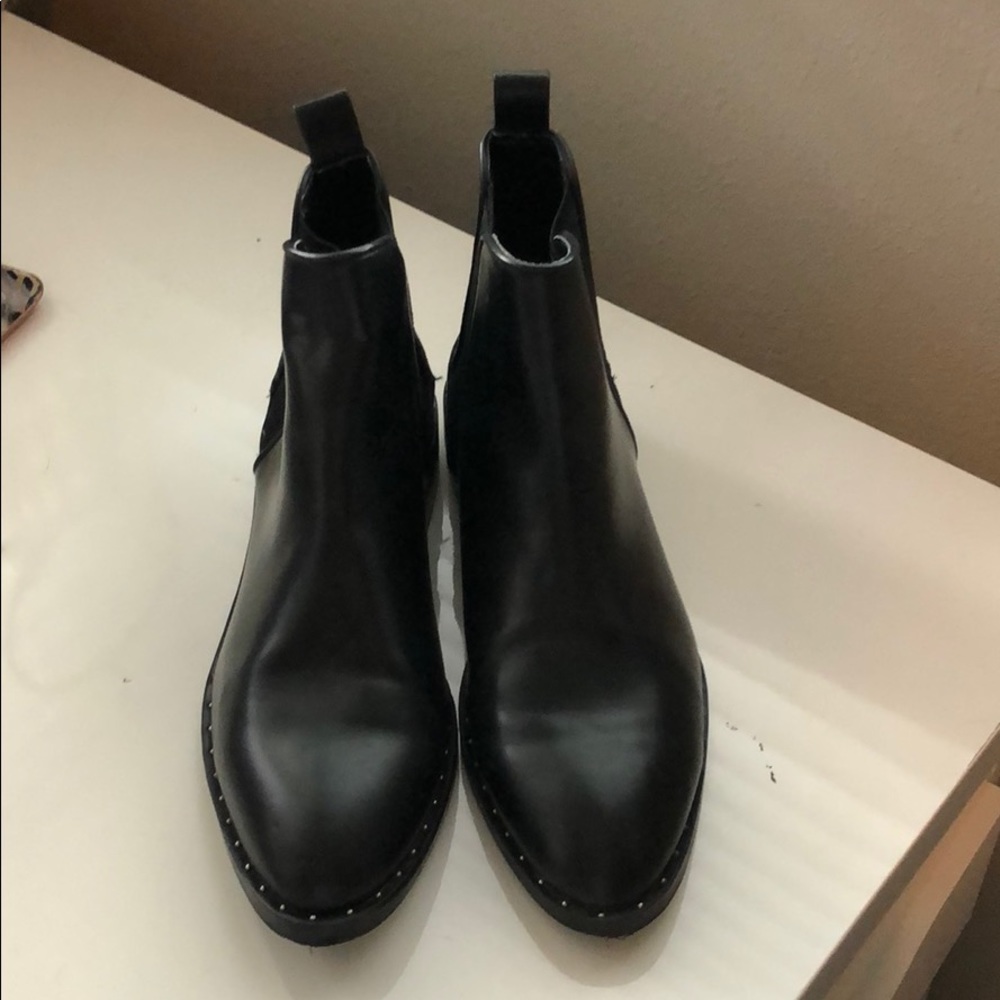 Black booties with stud detailing